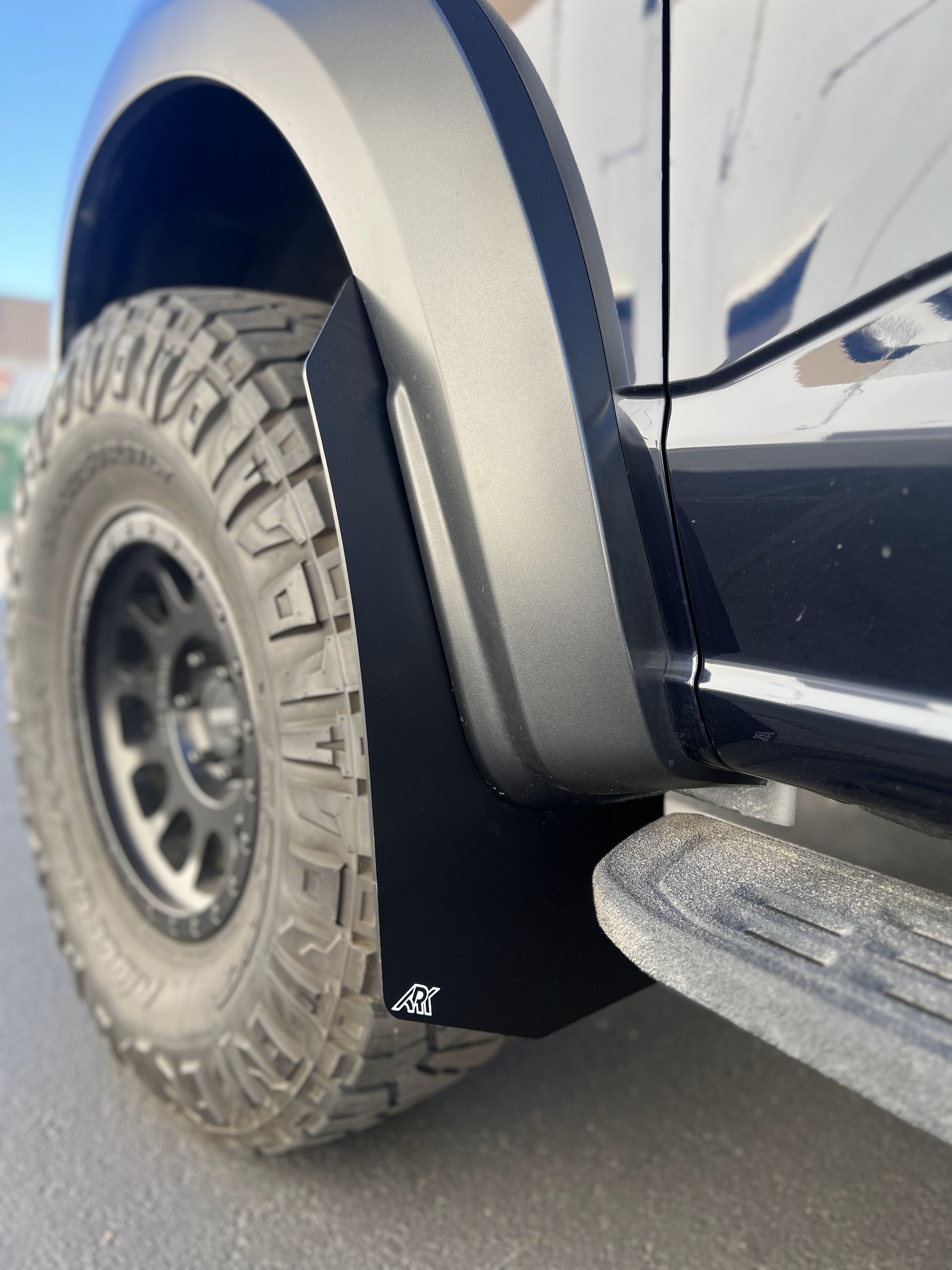 lifted truck tire with an Ark splash guard