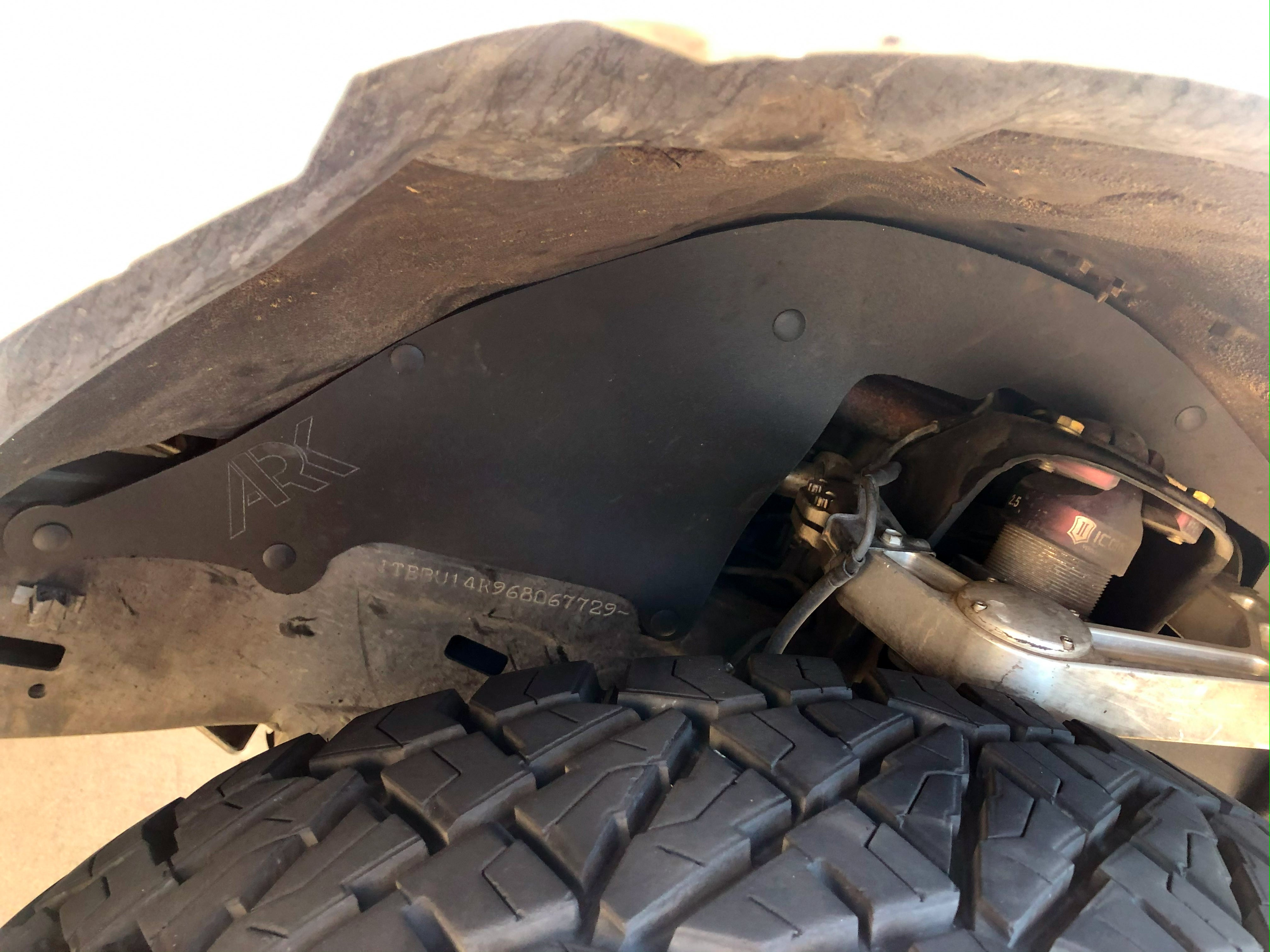 2003-2009 Toyota 4Runner after ark splash guards installed showing full coverage added protection and covered up what was before exposed components and gap between the fender liner and body of the 4runner exposing the engine bay