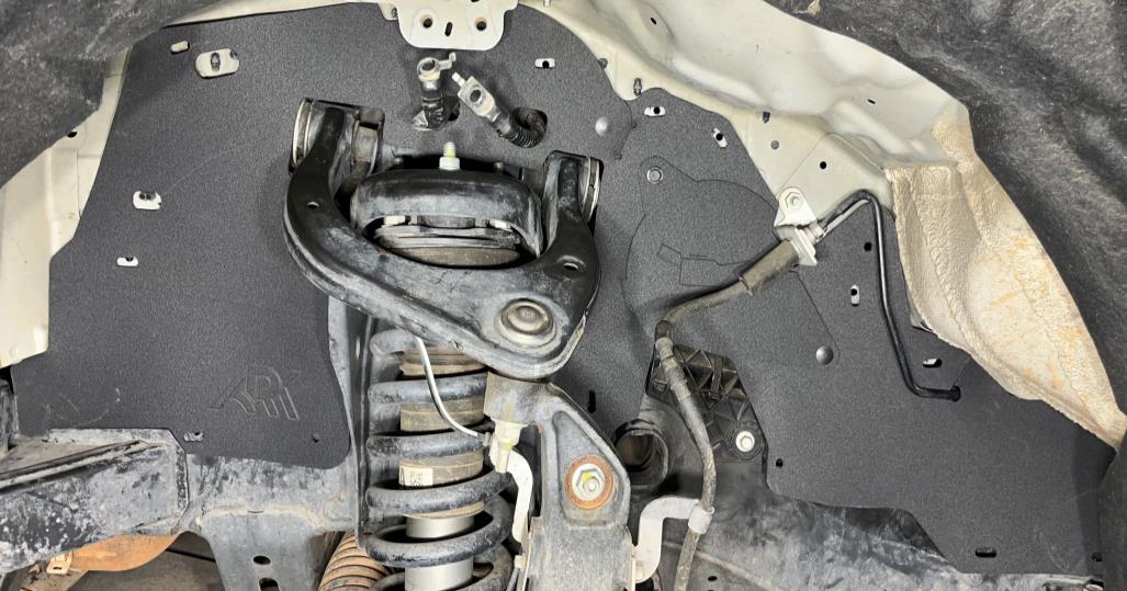 2019-2024 Ford Ranger after Ark Splash Guards showing covered up components and added full coverage protection around and behind the suspension featuring an easy access point oil lid