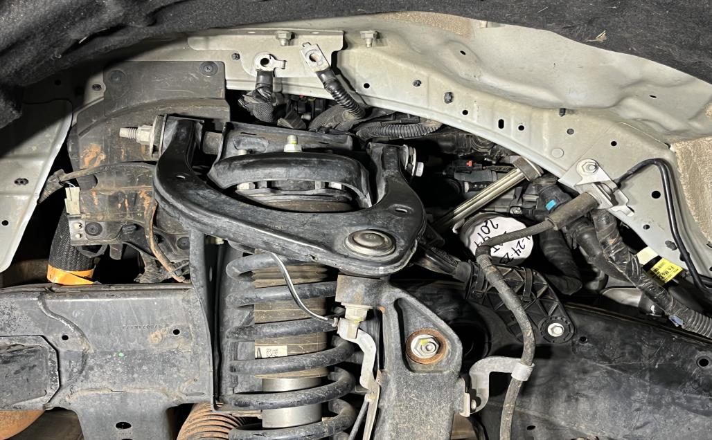2019-2024 Ranger before Ark Splash Guards showing exposed components and oil access point around and behind the suspension